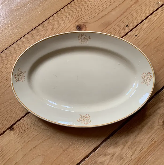 BOCH La Louvière zachtgeel ovalen bord met bloemmotief